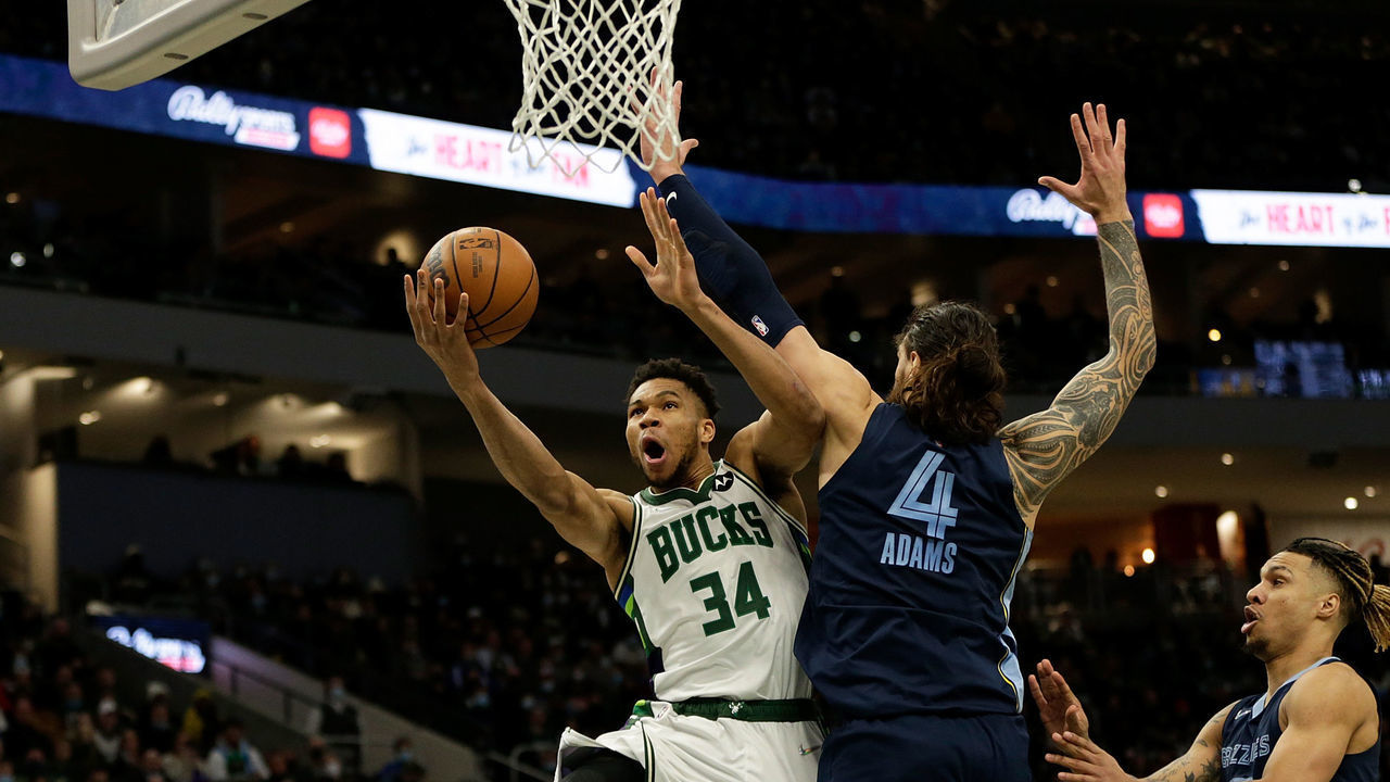 MILWAUKEE, WISCONSIN - JANUARY 19: Giannis Antetokounmpo #34 of the Milwaukee Bucks goes up for a shot on Steven Adams #4 of the Memphis Grizzlies at Fiserv Forum on January 19, 2022 in Milwaukee, Wisconsin.