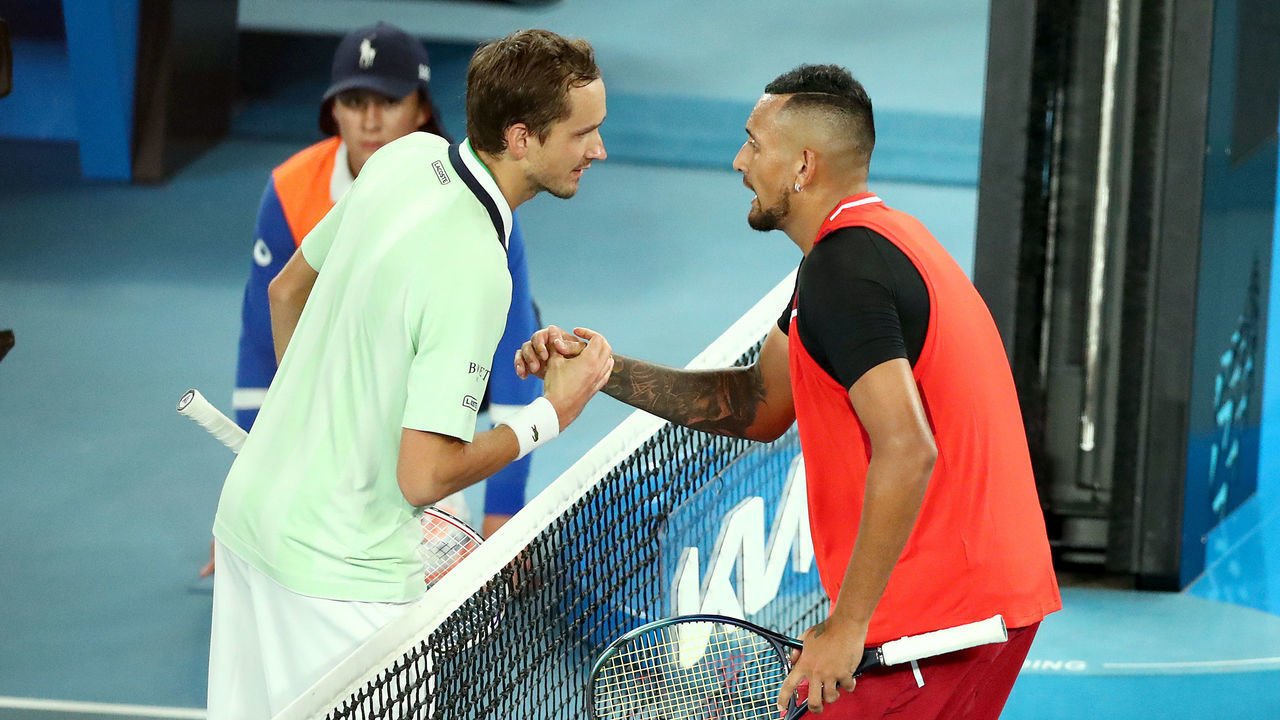MELBOURNE, AUSTRALIA - JANUARY 20: Daniil Medvedev of Russia and Nick Kyrgios of Australia shake hands after their match during day four of the 2022 Australian Open at Melbourne Park on January 20, 2022 in Melbourne, Australia.
