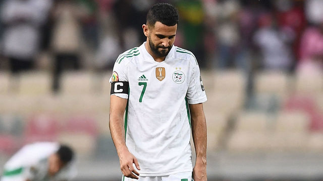 Algeria's forward Riyad Mahrez reacts after Ivory Coast's forward Nicolas Pepe (not seen) scored Ivory Coast's third goal during the Group E Africa Cup of Nations (CAN) 2021 football match between Ivory Coast and Algeria at Stade de Japoma in Douala on January 20, 2022.