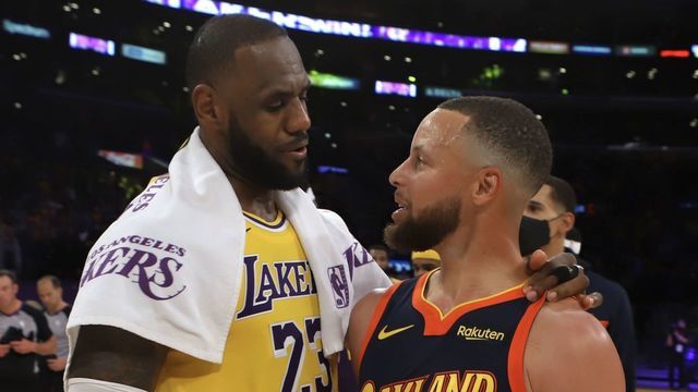 LOS ANGELES, CA - MAY 19: LeBron James #23 of the Los Angeles Lakers talks with Stephen Curry #30 of the Golden State Warriors after the game during the Play-In Tournament on May 19, 2021 at STAPLES Center in Los Angeles, California. NOTE TO USER: User expressly acknowledges and agrees that, by downloading and/or using this photograph, user is consenting to the terms and conditions of the Getty Images License Agreement. Mandatory Copyright Notice: Copyright 2021 NBAE