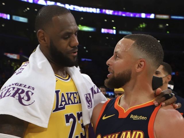 LOS ANGELES, CA - MAY 19: LeBron James #23 of the Los Angeles Lakers talks with Stephen Curry #30 of the Golden State Warriors after the game during the Play-In Tournament on May 19, 2021 at STAPLES Center in Los Angeles, California. NOTE TO USER: User expressly acknowledges and agrees that, by downloading and/or using this photograph, user is consenting to the terms and conditions of the Getty Images License Agreement. Mandatory Copyright Notice: Copyright 2021 NBAE