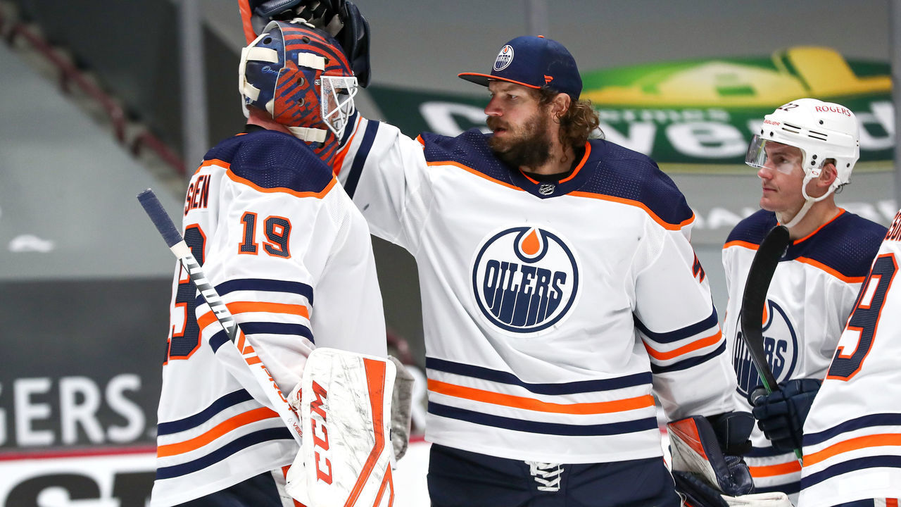VANCOUVER, BC - MAY 03: Edmonton Oilers Goalie Mike Smith (41) congratulates Oilers Goalie Mikko Koskinen (19) on a 5-3 victory over the Vancouver Canucks during their NHL game at Rogers Arena on May 3, 2021 in Vancouver, British Columbia, Canada.