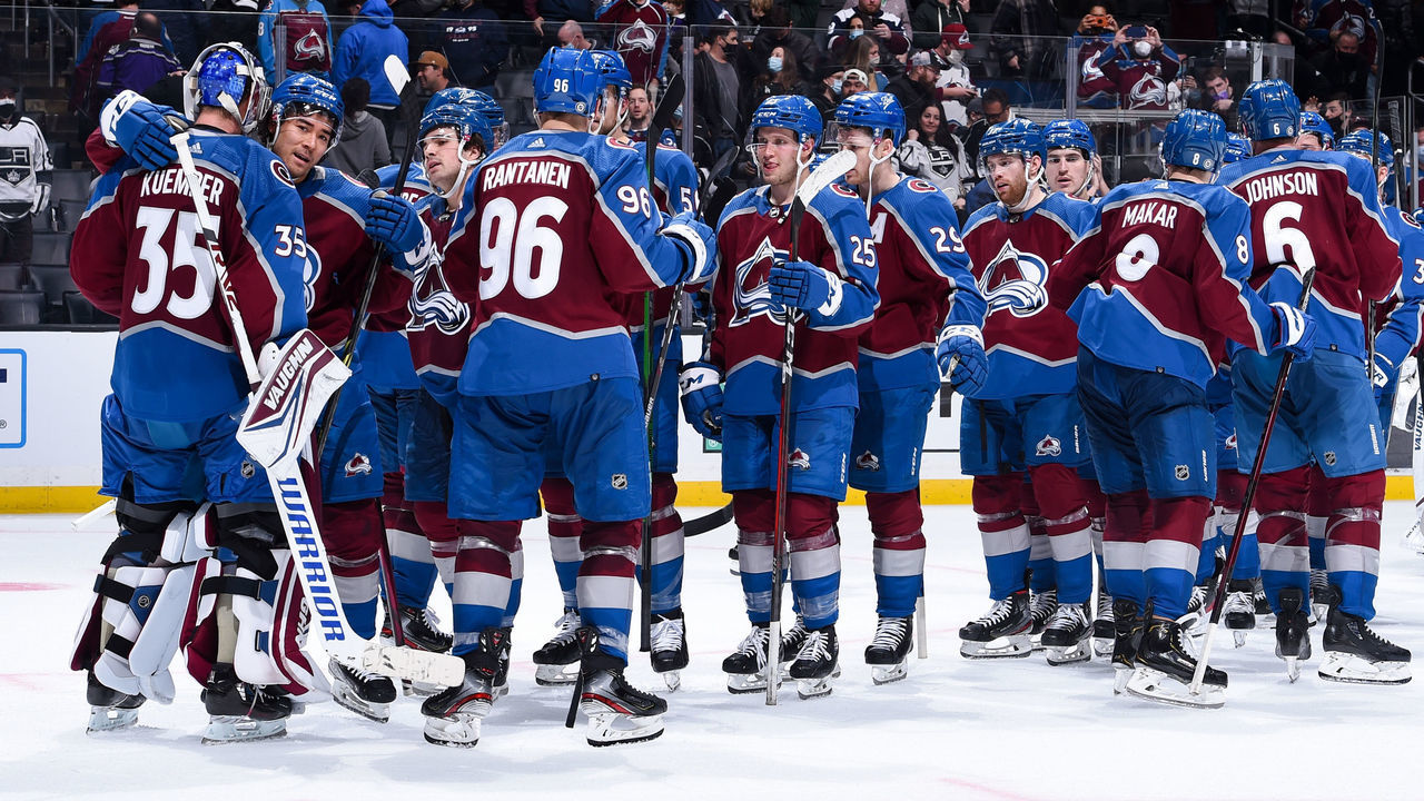LOS ANGELES, CA - JANUARY 20: Darcy Kuemper #35 of the Colorado Avalanche celebrates their win with teammates against the Los Angeles Kings at Crypto.com Arena on January 20, 2022 in Los Angeles, California.