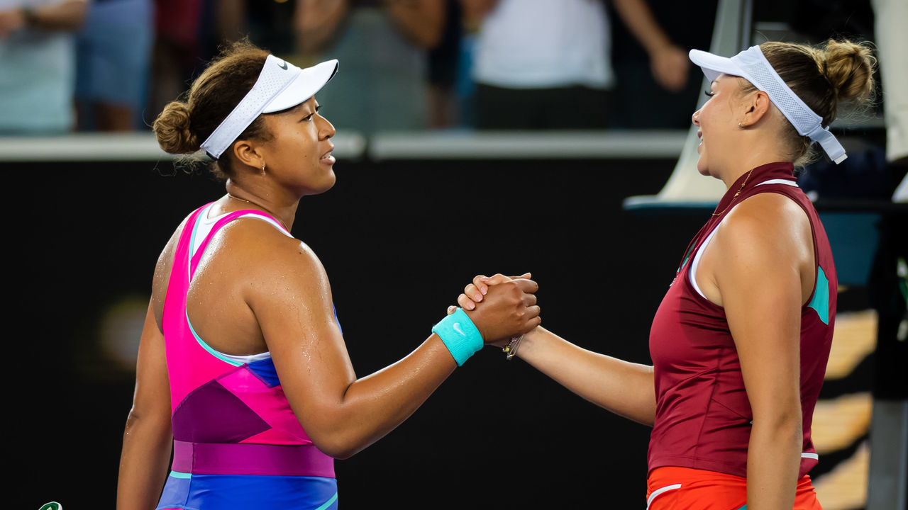 MELBOURNE, AUSTRALIA - JANUARY 21: Naomi Osaka of Japan and Amanda Anisimova of the United States meet at the net after Anisimovas victory in the third round singles match at the 2022 Australian Open at Melbourne Park on January 21, 2022 in Melbourne, Australia.