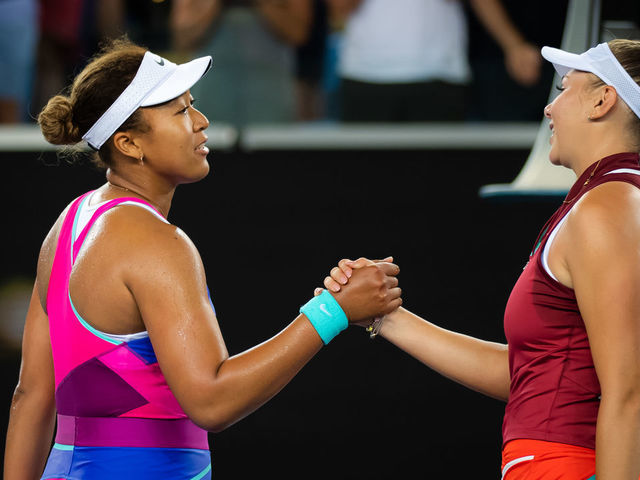 MELBOURNE, AUSTRALIA - JANUARY 21: Naomi Osaka of Japan and Amanda Anisimova of the United States meet at the net after Anisimovas victory in the third round singles match at the 2022 Australian Open at Melbourne Park on January 21, 2022 in Melbourne, Australia.