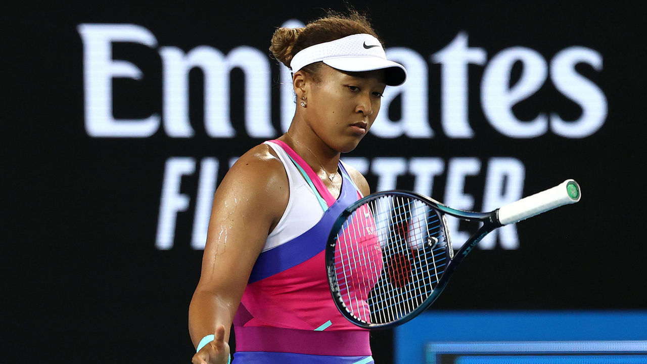 MELBOURNE, AUSTRALIA - JANUARY 21: Naomi Osaka of Japan bounces her racquet in her third round singles match against Amanda Anisimova of United States during day five of the 2022 Australian Open at Melbourne Park on January 21, 2022 in Melbourne, Australia.