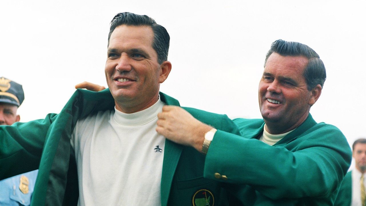 AUGUSTA, GA - APRIL 1968: Masters Champion Bob Goalby receives his Green Jacket from 1967 Masters Champion Gay Brewer at the Presentation Ceremony during the 1968 Masters Tournament at Augusta National Golf Club on April 14th, 1968 in Augusta, Georgia.