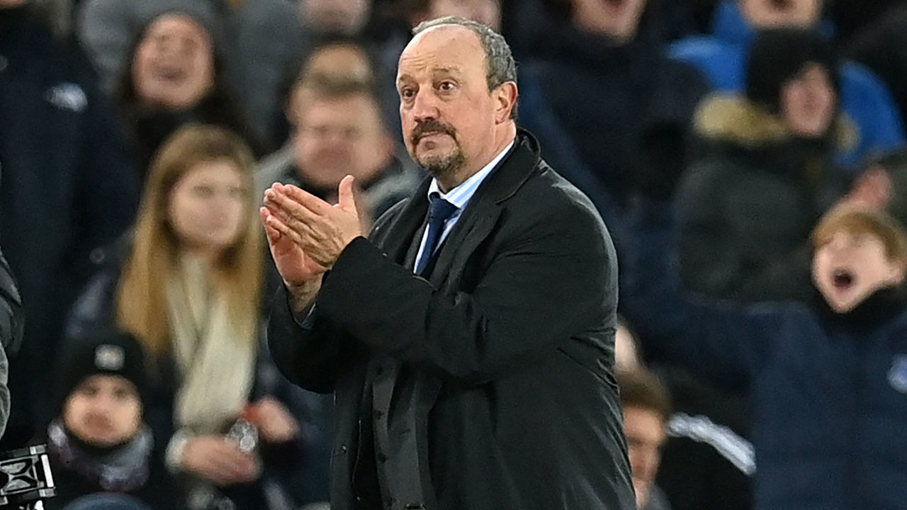 Everton's Spanish manager Rafael Benítez applauds supporters as he leaves after the English Premier League football match between Everton and Arsenal at Goodison Park in Liverpool, north west England on December 6, 2021. - Everton won the game 2-1. - RESTRICTED TO EDITORIAL USE. No use with unauthorized audio, video, data, fixture lists, club/league logos or 'live' services. Online in-match use limited to 120 images. An additional 40 images may be used in extra time. No video emulation. Social media in-match use limited to 120 images. An additional 40 images may be used in extra time. No use in betting publications, games or single club/league/player publications.