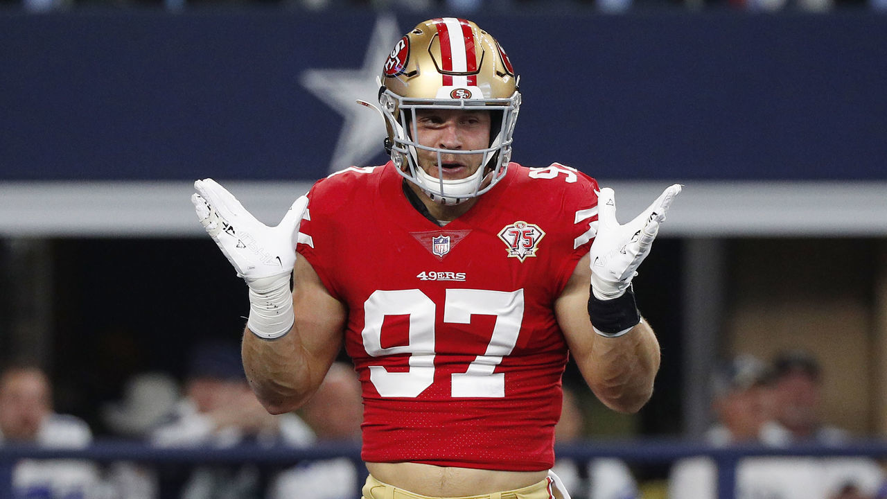 ARLINGTON, TEXAS - JANUARY 16: Nick Bosa #97 of the San Francisco 49ers reacts after a sack against the Dallas Cowboys during the first quarter in the NFC Wild Card Playoff game at AT&T Stadium on January 16, 2022 in Arlington, Texas.