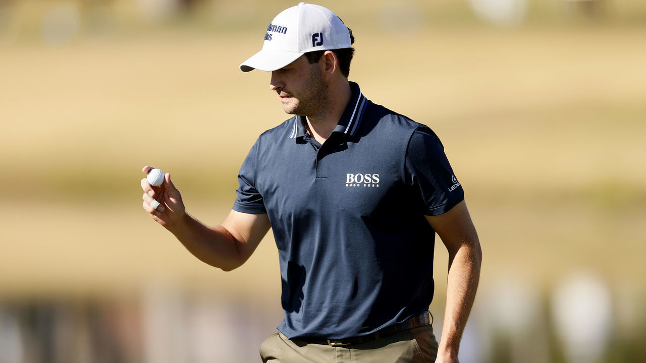 LA QUINTA, CALIFORNIA - JANUARY 21: Patrick Cantlay picks up his ball on the 12th hole during the second round of The American Express at the Jack Nicklaus Tournament Course at PGA West on January 21, 2022 in La Quinta, California.