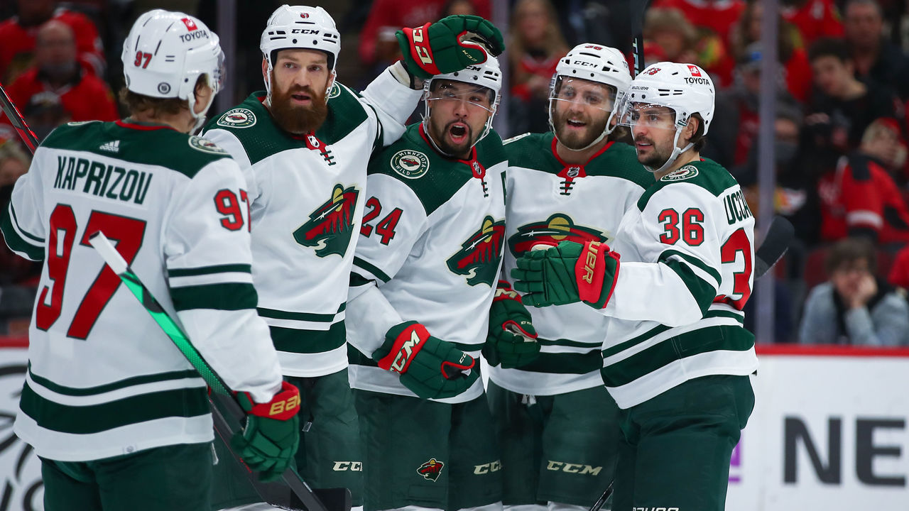 CHICAGO, IL - JANUARY 21: Minnesota Wild Center Ryan Hartman (38) celebrates with his teammates after scoring a goal during a game between the Minnesota Wild and the Chicago Blackhawks on January 21, 2022 at the United Center in Chicago, IL.