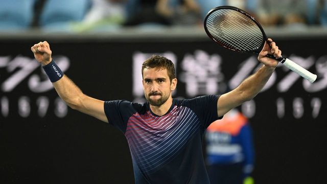 Croatia's Marin Cilic celebrates after victory against Russia's Andrey Rublev during their men's singles match on day six of the Australian Open tennis tournament in Melbourne on January 22, 2022. - -- IMAGE RESTRICTED TO EDITORIAL USE - STRICTLY NO COMMERCIAL USE --