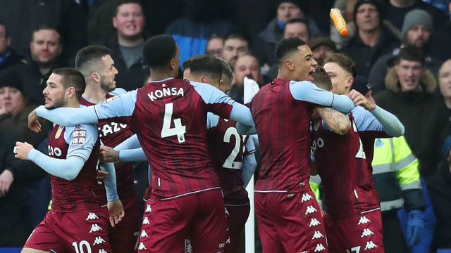 LIVERPOOL, ENGLAND - JANUARY 22: Lucas Digne of Aston Villa (obscured) is hit by an object thrown from the crowd after celebrating their sides first goal during the Premier League match between Everton and Aston Villa at Goodison Park on January 22, 2022 in Liverpool, England.