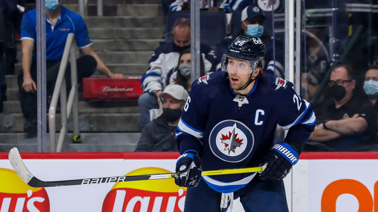 WINNIPEG, MB - NOVEMBER 29: Blake Wheeler #26 of the Winnipeg Jets keeps an eye on the play during first period action against the Arizona Coyotes at Canada Life Centre on November 29, 2021 in Winnipeg, Manitoba, Canada.