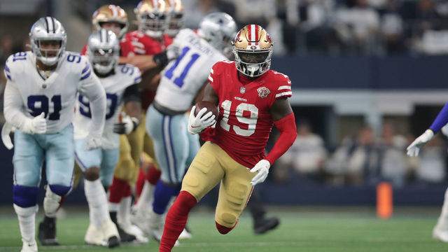 ARLINGTON, TX - JANUARY 16: Deebo Samuel #19 of the San Francisco 49ers runs after making a catch during the NFC Wild Card Playoff game against the Dallas Cowboys at AT&T Stadium on January 16, 2022 in Arlington, Texas. The 49ers defeated the Cowboys 23-17.