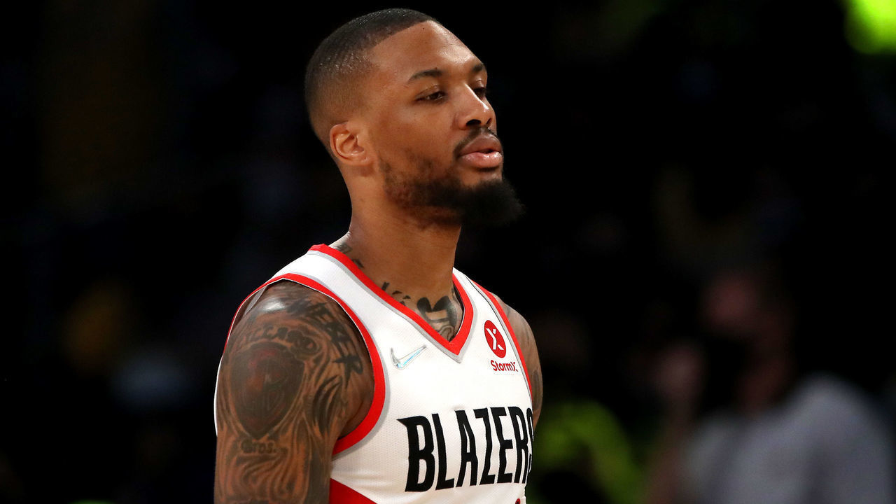 LOS ANGELES, CALIFORNIA - DECEMBER 31: Damian Lillard #0 of the Portland Trail Blazers reacts to a play against the Los Angeles Lakers during the first quarter at Crypto.com Arena on December 31, 2021 in Los Angeles, California.
