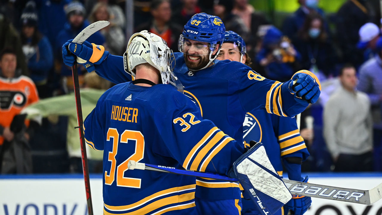 BUFFALO, NY - JANUARY 22: Alex Tuch #89 celebrates with Michael Houser #32 of the Buffalo Sabres after an NHL game against the Philadelphia Flyers on January 22, 2022 at KeyBank Center in Buffalo, New York. Buffalo won, 6-3.