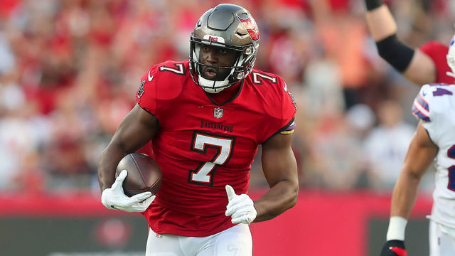 TAMPA, FL - DECEMBER 12: Tampa Bay Buccaneers Running Back Leonard Fournette (7) runs the ball to the end zone for a touchdown during the regular season game between the Buffalo Bills and the Tampa Bay Buccaneers on December 12, 2021 at Raymond James Stadium in Tampa, Florida.