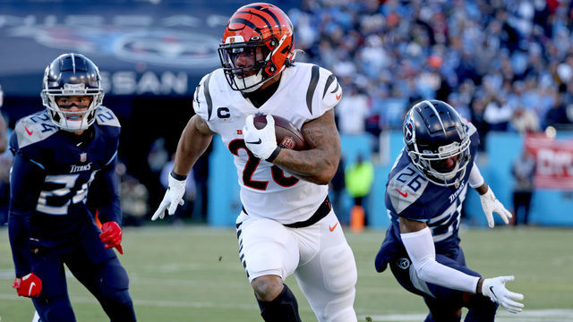 NASHVILLE, TENNESSEE - JANUARY 22: Running back Joe Mixon #28 of the Cincinnati Bengals rushes the ball in the first quarter against the Tennessee Titans in the AFC Divisional Playoff game at Nissan Stadium on January 22, 2022 in Nashville, Tennessee.