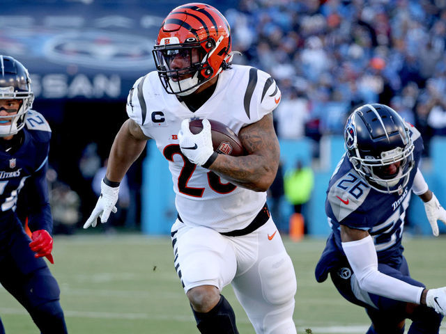 NASHVILLE, TENNESSEE - JANUARY 22: Running back Joe Mixon #28 of the Cincinnati Bengals rushes the ball in the first quarter against the Tennessee Titans in the AFC Divisional Playoff game at Nissan Stadium on January 22, 2022 in Nashville, Tennessee.