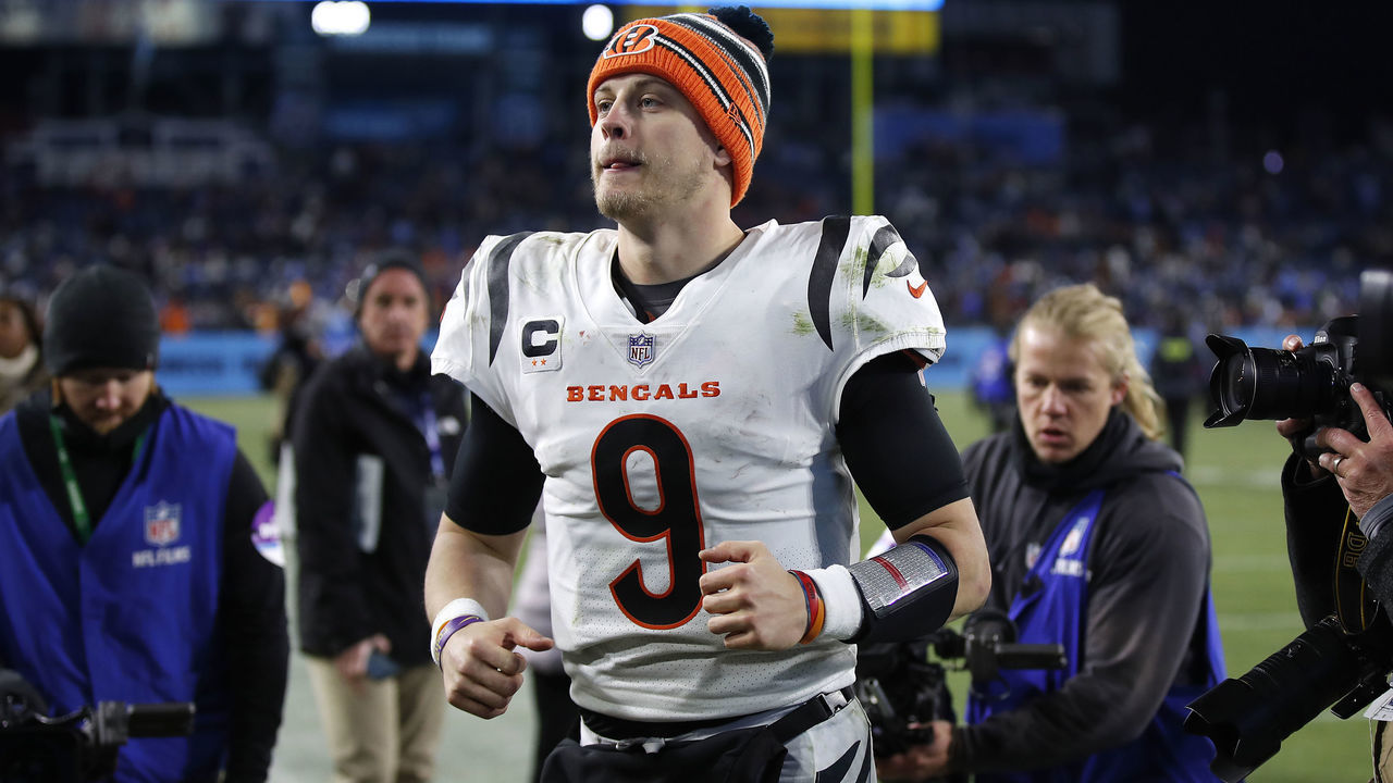 NASHVILLE, TENNESSEE - JANUARY 22: Quarterback Joe Burrow #9 of the Cincinnati Bengals runs off the field following the Bengals 19-16 win over the Tennessee Titans in the AFC Divisional Playoff game at Nissan Stadium on January 22, 2022 in Nashville, Tennessee.