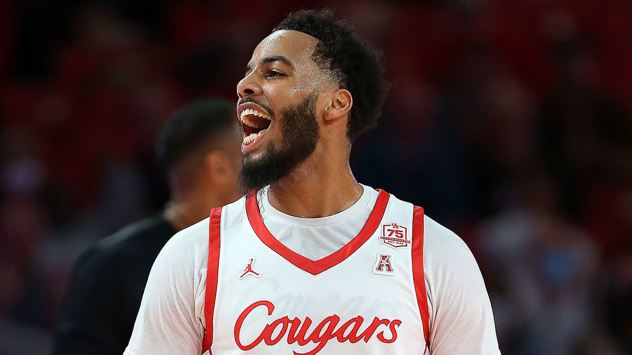 HOUSTON, TEXAS - JANUARY 22: Kyler Edwards #11 of the Houston Cougars reacts after making a three-point shot against the East Carolina Pirates at Fertitta Center on January 22, 2022 in Houston, Texas.