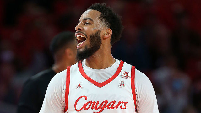 HOUSTON, TEXAS - JANUARY 22: Kyler Edwards #11 of the Houston Cougars reacts after making a three-point shot against the East Carolina Pirates at Fertitta Center on January 22, 2022 in Houston, Texas.