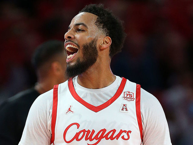 HOUSTON, TEXAS - JANUARY 22: Kyler Edwards #11 of the Houston Cougars reacts after making a three-point shot against the East Carolina Pirates at Fertitta Center on January 22, 2022 in Houston, Texas.