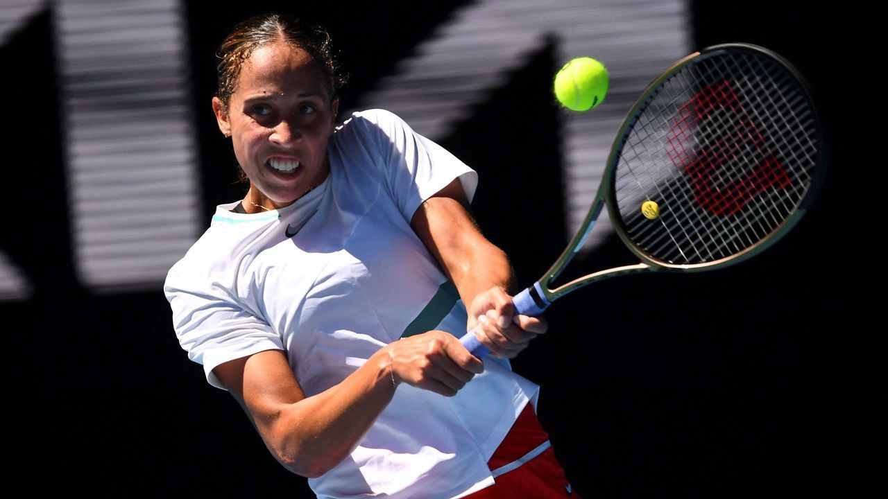 Madison Keys of the US hits a return against Spain's Paula Badosa during their women's singles match on day seven of the Australian Open tennis tournament in Melbourne on January 23, 2022. - -- IMAGE RESTRICTED TO EDITORIAL USE - STRICTLY NO COMMERCIAL USE --