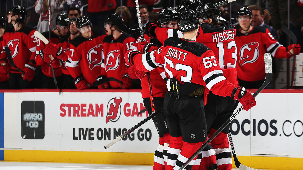 NEWARK, NJ - JANUARY 22: Jack Hughes #86 of the New Jersey Devils is congratulated by his teammates after scoring a goal against the Carolina Hurricanes during the third period at Prudential Center on January 22, 2021 in Newark, New Jersey.