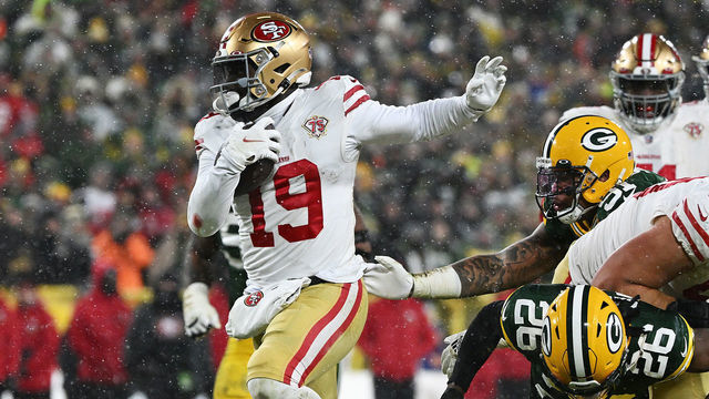 GREEN BAY, WISCONSIN - JANUARY 22: Wide receiver Deebo Samuel #19 of the San Francisco 49ers carries the ball after a catch during the 3rd quarter of the NFC Divisional Playoff game against the Green Bay Packers at Lambeau Field on January 22, 2022 in Green Bay, Wisconsin.