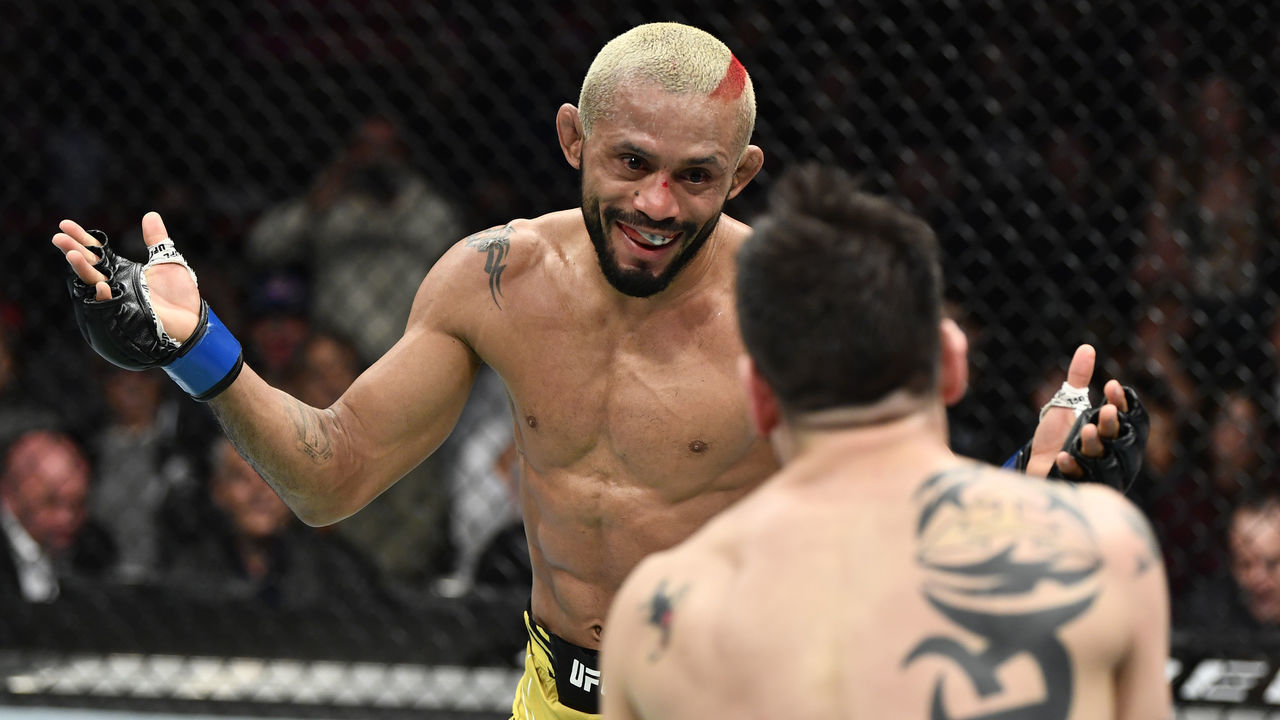 ANAHEIM, CALIFORNIA - JANUARY 22: (L-R) Deiveson Figueiredo of Brazil battles Brandon Moreno of Mexico in their UFC flyweight championship fight during the UFC 270 event at Honda Center on January 22, 2022 in Anaheim, California.