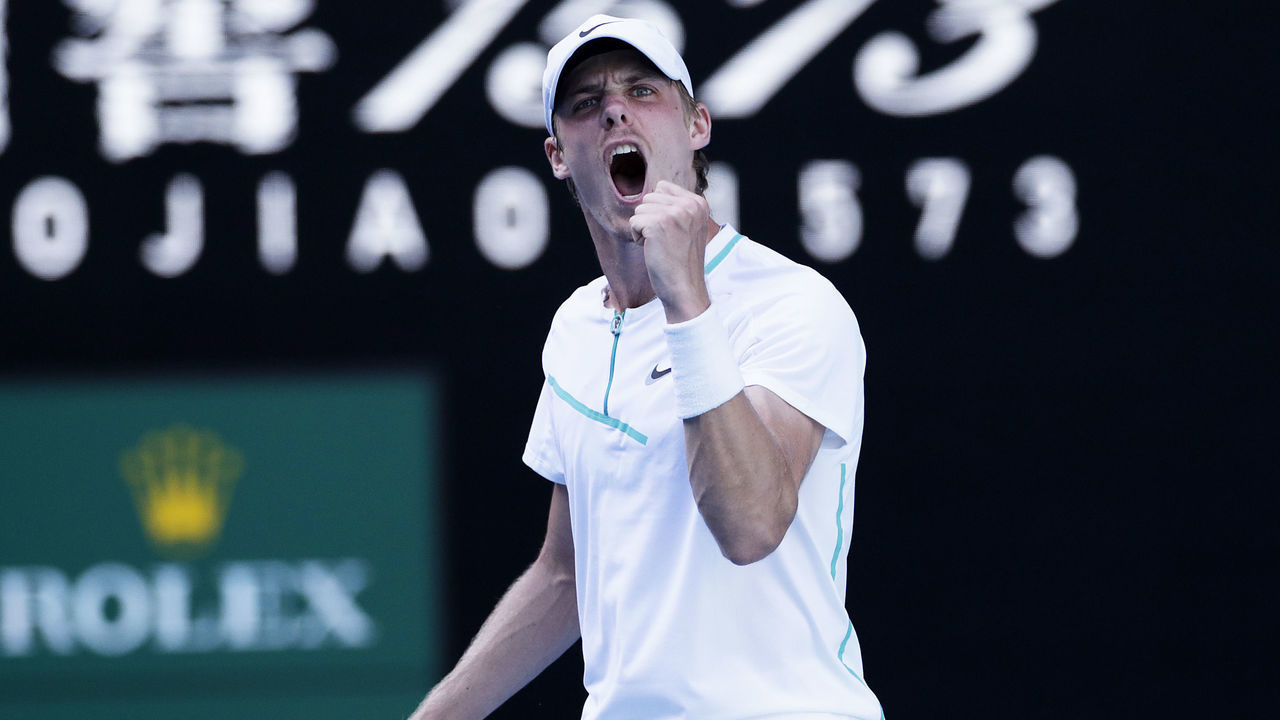 MELBOURNE, AUSTRALIA - JANUARY 23: Denis Shapovalov of Canada celebrates after winning a point in his fourth round singles match against Alexander Zverev of Germany during day seven of the 2022 Australian Open at Melbourne Park on January 23, 2022 in Melbourne, Australia.