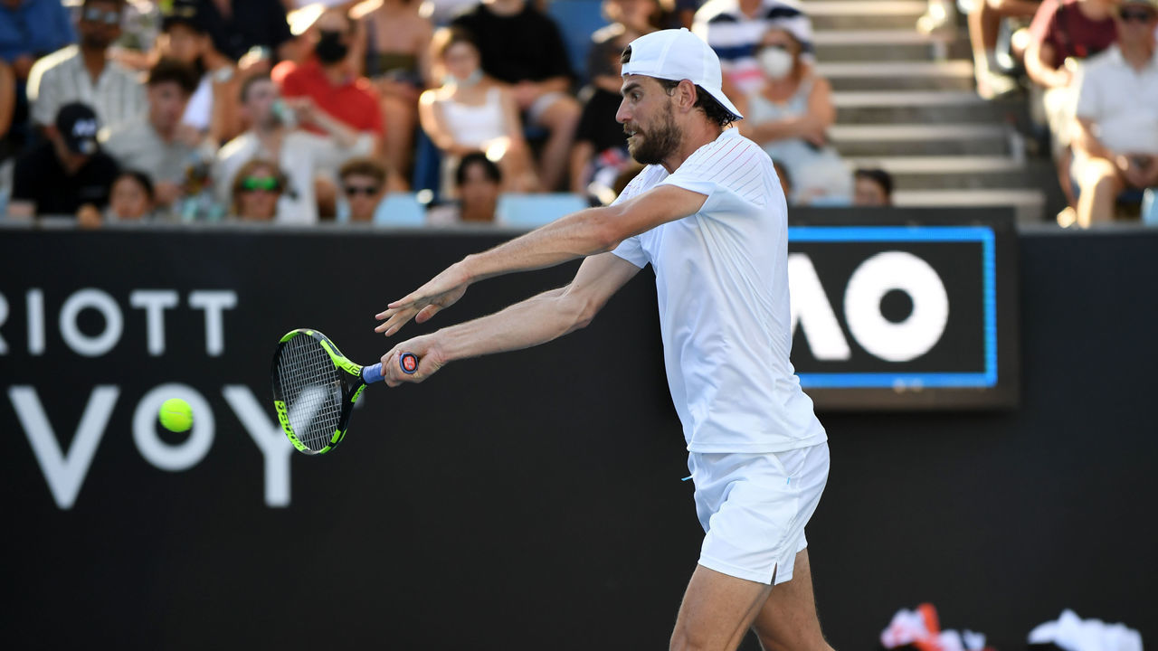MELBOURNE, AUSTRALIA - JANUARY 22: Maxime Cressy of United States in action against Christopher O'Connell (not seen) of Australia during their men's singles match of the Australian Open Tennis Tournament at Melbourne Park in Melbourne, Australia on January 22, 2022.