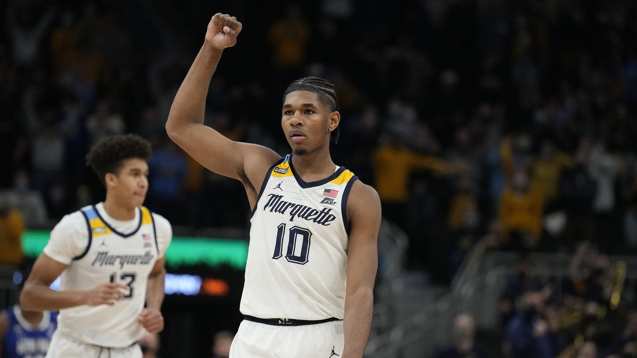 MILWAUKEE, WISCONSIN - JANUARY 15: Justin Lewis #10 of the Marquette Golden Eagles celebrates after a play near the end of the second half against the Seton Hall Pirates at Fiserv Forum on January 15, 2022 in Milwaukee, Wisconsin.