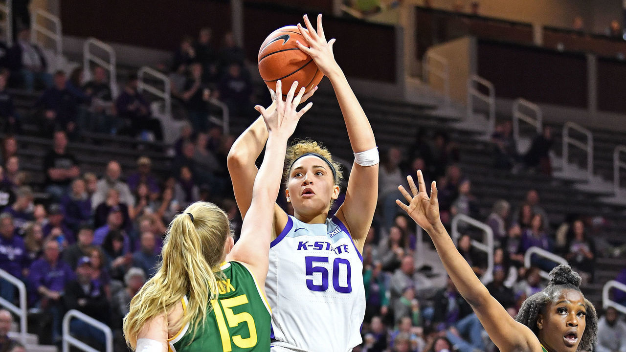 MANHATTAN, KS - FEBRUARY 08: Ayoka Lee #50 of the Kansas State Wildcats puts up a shot against Lauren Cox #15 of the Baylor Lady Bears during the third quarter on February 8, 2020 at Bramlage Coliseum in Manhattan, Kansas.