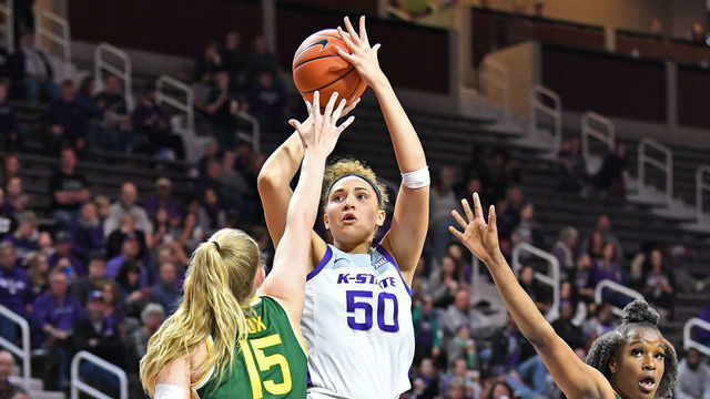 MANHATTAN, KS - FEBRUARY 08: Ayoka Lee #50 of the Kansas State Wildcats puts up a shot against Lauren Cox #15 of the Baylor Lady Bears during the third quarter on February 8, 2020 at Bramlage Coliseum in Manhattan, Kansas.