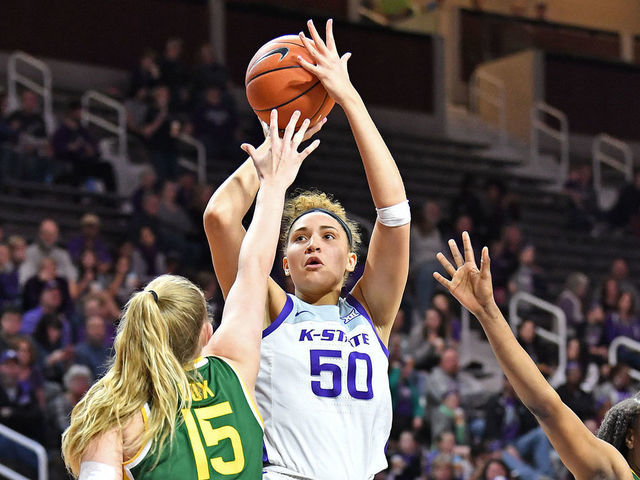 MANHATTAN, KS - FEBRUARY 08: Ayoka Lee #50 of the Kansas State Wildcats puts up a shot against Lauren Cox #15 of the Baylor Lady Bears during the third quarter on February 8, 2020 at Bramlage Coliseum in Manhattan, Kansas.