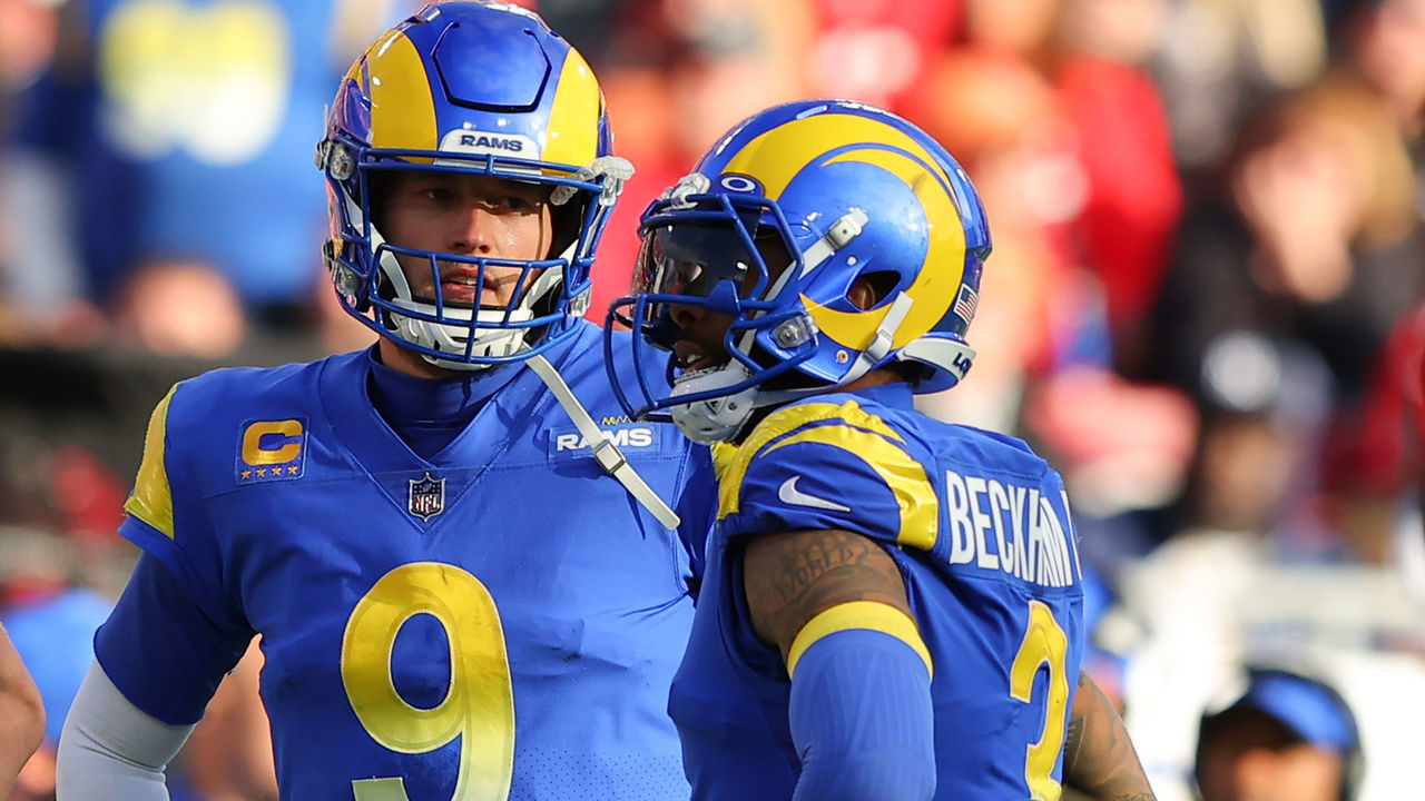 TAMPA, FLORIDA - JANUARY 23: Odell Beckham Jr. #3 and Matthew Stafford #9 of the Los Angeles Rams talk in the second quarter of the game against the Tampa Bay Buccaneers in the NFC Divisional Playoff game at Raymond James Stadium on January 23, 2022 in Tampa, Florida.