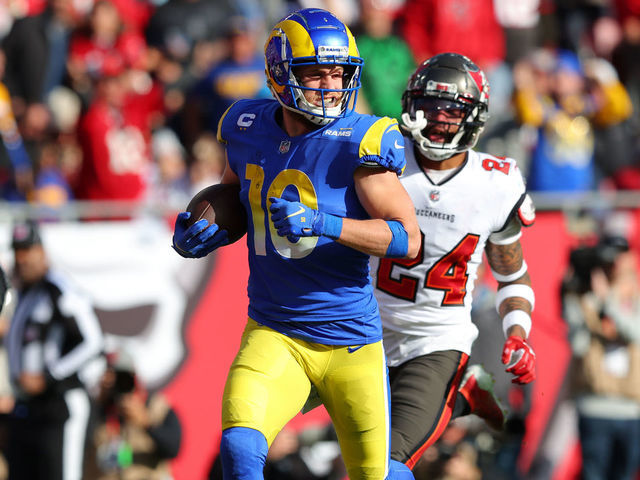 TAMPA, FLORIDA - JANUARY 23: Cooper Kupp #10 of the Los Angeles Rams runs the ball into the end zone for a touchdown in the second quarter of the game against the Tampa Bay Buccaneers in the NFC Divisional Playoff game at Raymond James Stadium on January 23, 2022 in Tampa, Florida.