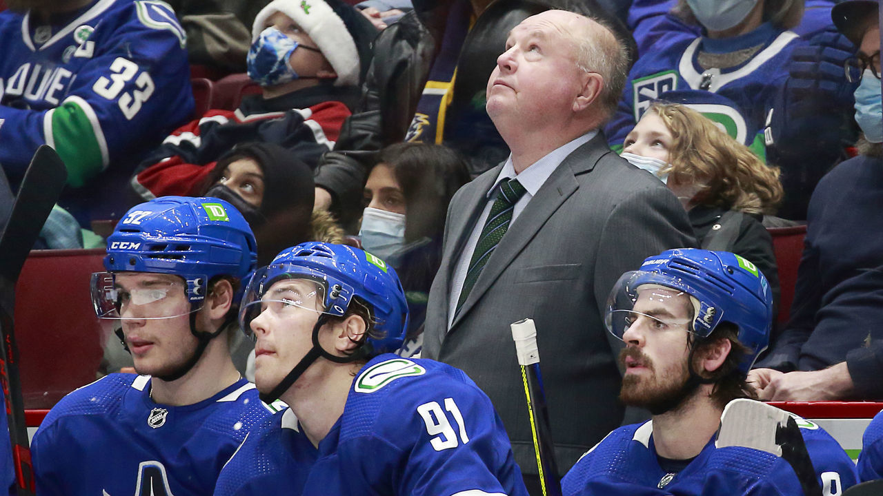 VANCOUVER, BC - DECEMBER 10: Head coach Bruce Boudreau of the Vancouver Canucks looks on from the bench during their NHL game against the Winnipeg Jets at Rogers Arena December 10, 2021 in Vancouver, British Columbia, Canada.