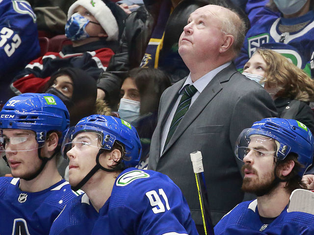 VANCOUVER, BC - DECEMBER 10: Head coach Bruce Boudreau of the Vancouver Canucks looks on from the bench during their NHL game against the Winnipeg Jets at Rogers Arena December 10, 2021 in Vancouver, British Columbia, Canada.