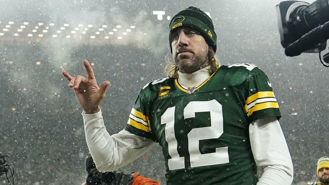 GREEN BAY, WISCONSIN - JANUARY 22: Quarterback Aaron Rodgers #12 of the Green Bay Packers gestures as he exits the field after losing the NFC Divisional Playoff game to the San Francisco 49ers at Lambeau Field on January 22, 2022 in Green Bay, Wisconsin.