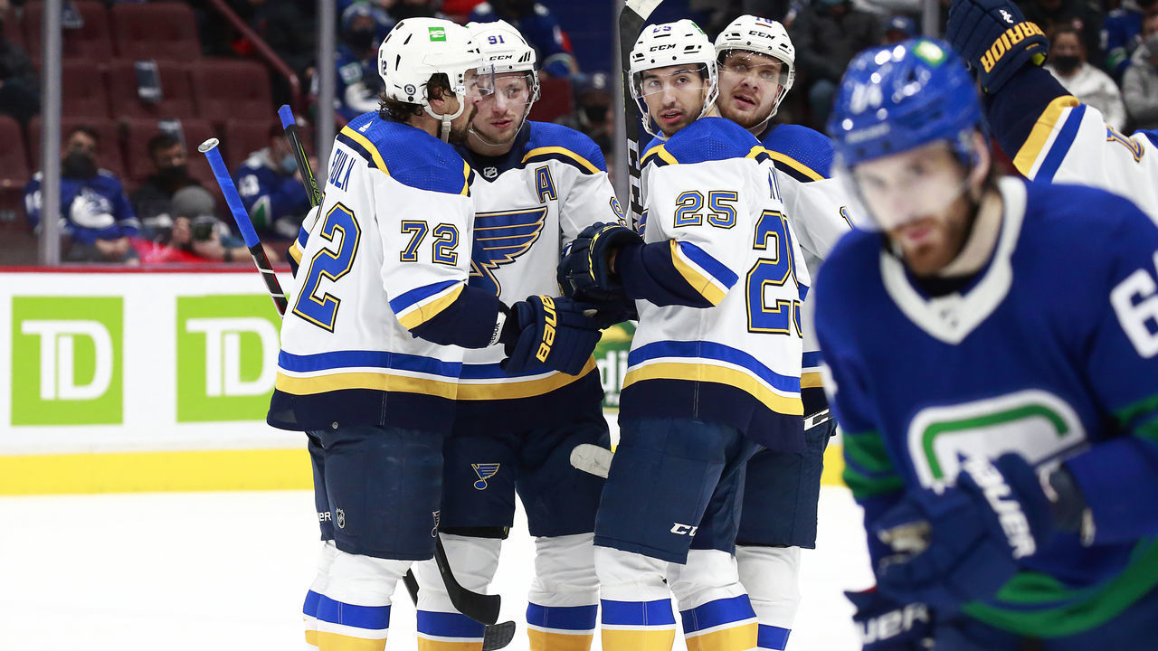 VANCOUVER, BC - JANUARY 23: Jordan Kyrou #25 of the St. Louis Blues is congratulated by teammates after scoring during their NHL game against the Vancouver Canucks at Rogers Arena January 23, 2022 in Vancouver, British Columbia, Canada.