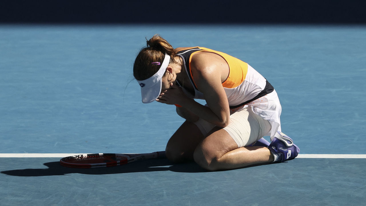France's Alize Cornet celebrates her win against Romania's Simona Halep during their women's singles match on day eight of the Australian Open tennis tournament in Melbourne on January 24, 2022. - -- IMAGE RESTRICTED TO EDITORIAL USE - STRICTLY NO COMMERCIAL USE --