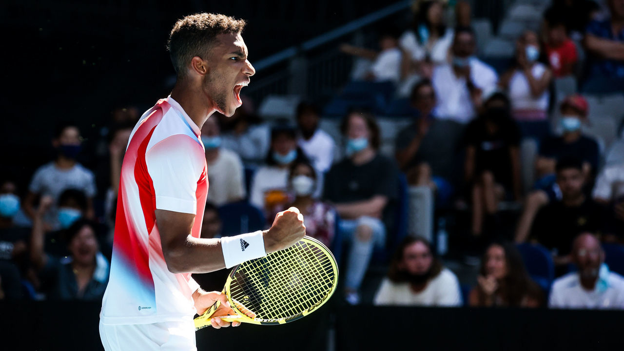 MELBOURNE, AUSTRALIA - JANUARY 24: Felix Auger-Aliassime of Canada on his way to beating Marin Cilic of Croatia on day 8 of the 2022 Australian Open at Melbourne Park on January 24, 2022 in Melbourne, Australia.