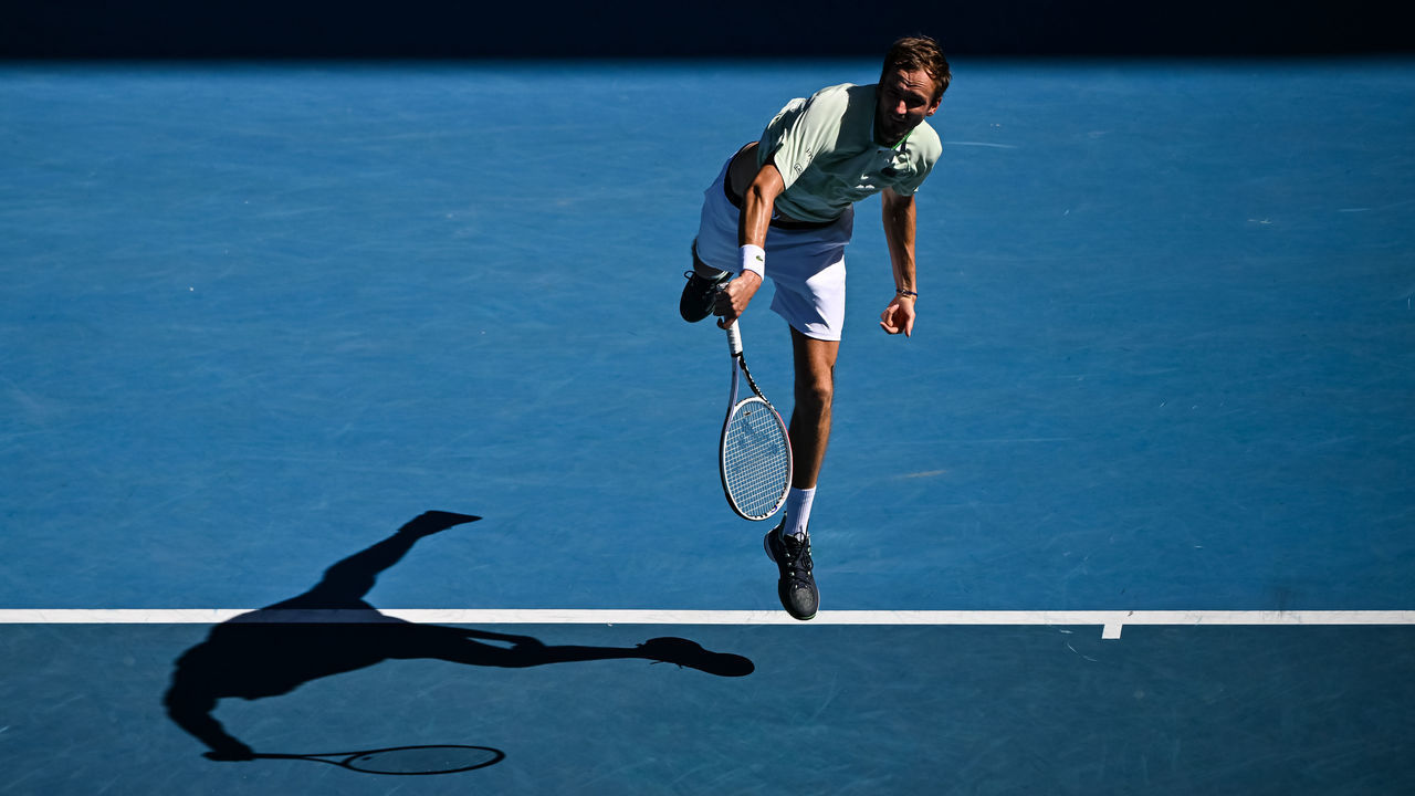 MELBOURNE, AUSTRALIA - JANUARY 24: Daniil Medvedev of Russia serves against Maxime Cressy of the United States during day eight of the 2022 Australian Open at Melbourne Park on January 24, 2022 in Melbourne, Australia.