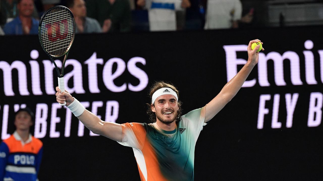 Greece's Stefanos Tsitsipas celebrates after beating Taylor Fritz of the US in their men's singles match at the Australian Open tennis tournament in Melbourne on January 25, 2022. - -- IMAGE RESTRICTED TO EDITORIAL USE - STRICTLY NO COMMERCIAL USE --