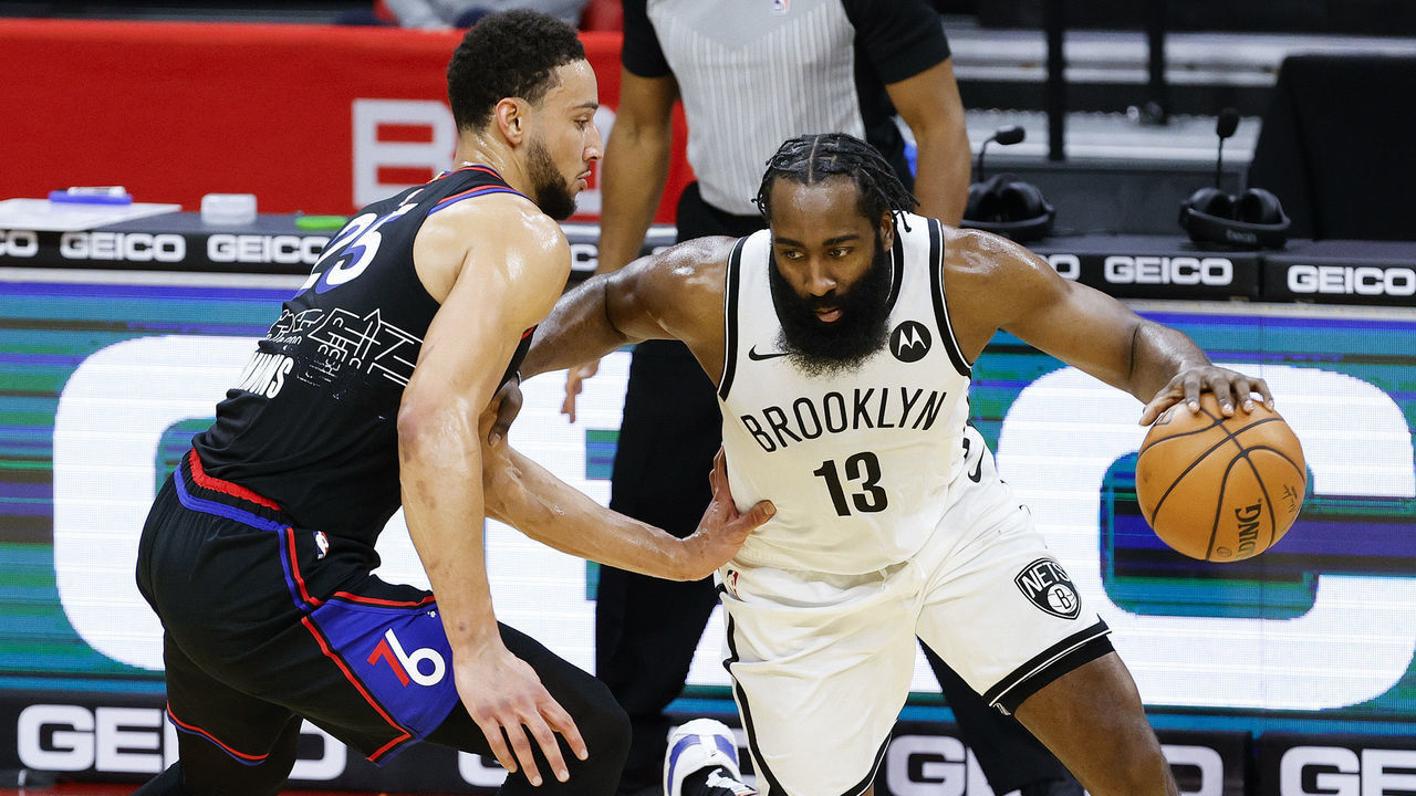 PHILADELPHIA, PENNSYLVANIA - FEBRUARY 06: James Harden #13 of the Brooklyn Nets drives against Ben Simmons #25 of the Philadelphia 76ers during the third quarter at Wells Fargo Center on February 06, 2021 in Philadelphia, Pennsylvania.