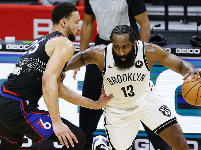 PHILADELPHIA, PENNSYLVANIA - FEBRUARY 06: James Harden #13 of the Brooklyn Nets drives against Ben Simmons #25 of the Philadelphia 76ers during the third quarter at Wells Fargo Center on February 06, 2021 in Philadelphia, Pennsylvania.